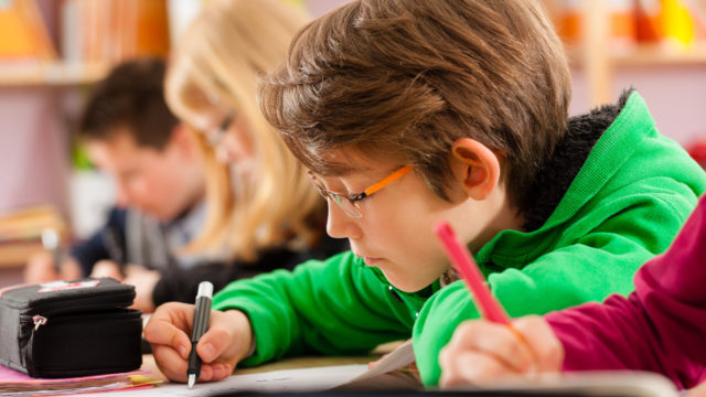 Education - Pupils at primary or elementary school doing their h